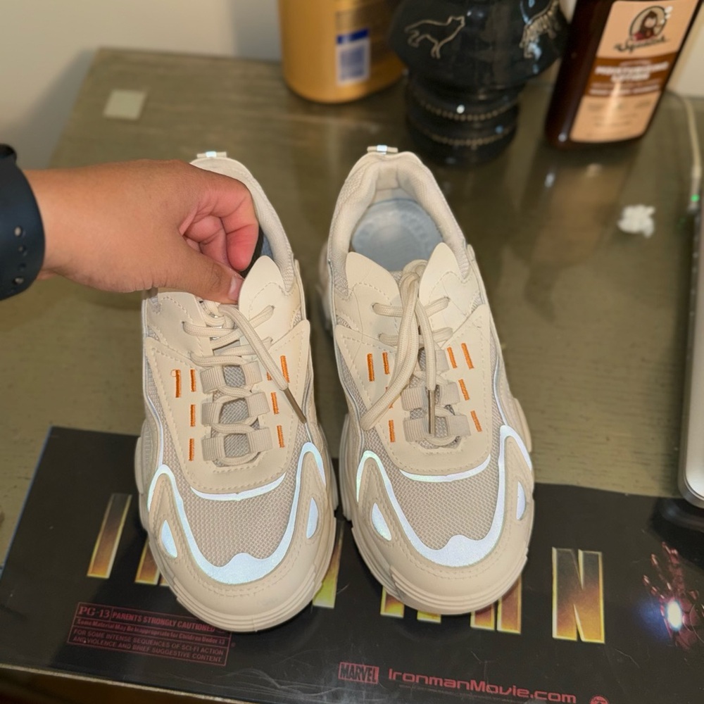 Beige and White Sneakers with Orange Accents
